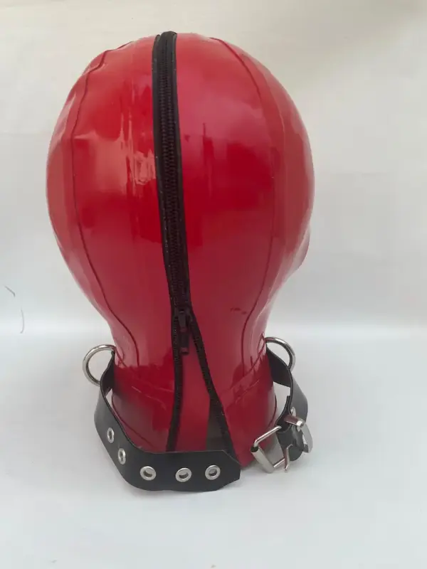 Rear view of red latex hood with zipper and protective guard