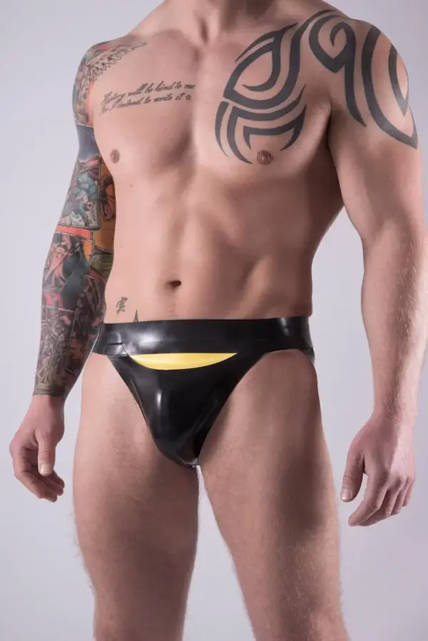 Close up of yellow horizontal fly on black latex underwear