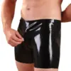 Close up of black latex shorts with structured seams and zipper