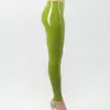 Woman wearing vibrant latex leggings clubwear style