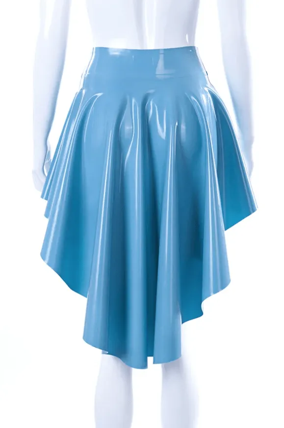 Model wearing voluminous rubber circle skirt showing dramatic high low hemline and light blue finish