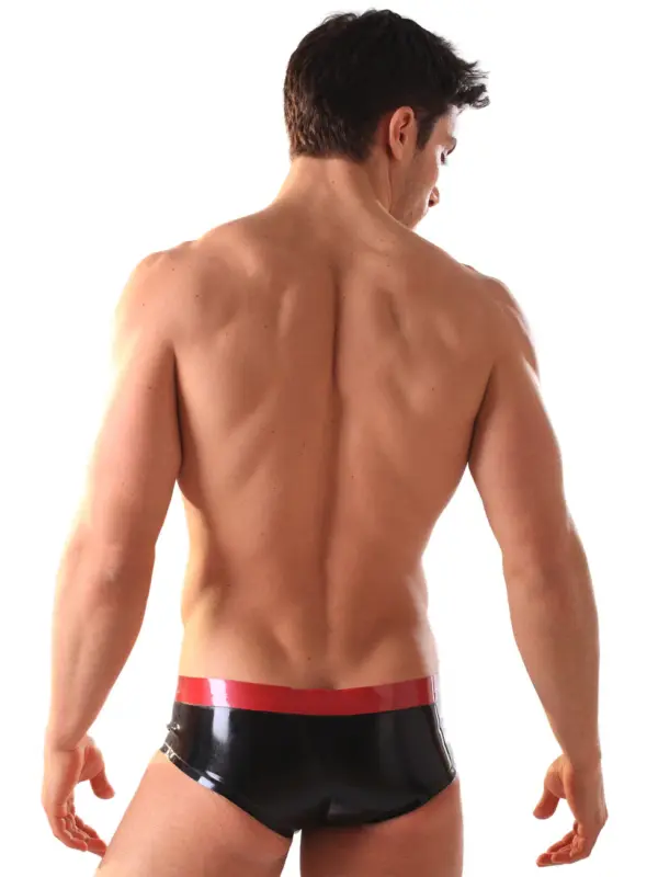 Close up of contoured pouch on black rubber briefs with red band