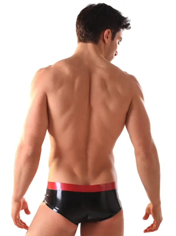 Close up of contoured pouch on black rubber briefs with red band