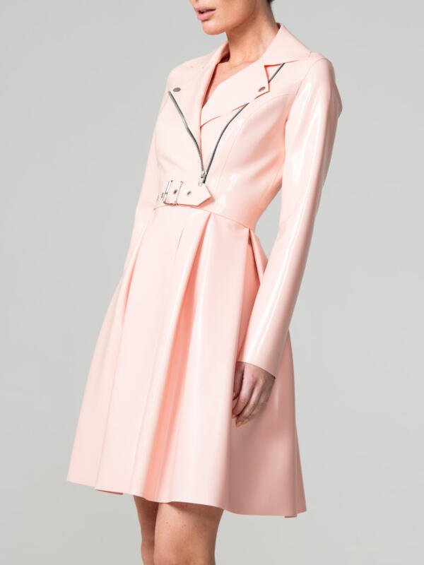 Model wearing elegant light pink rubber flared coat showing asymmetrical zip
