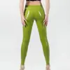 Shiny Green Rubber Pants rear view showing high waist