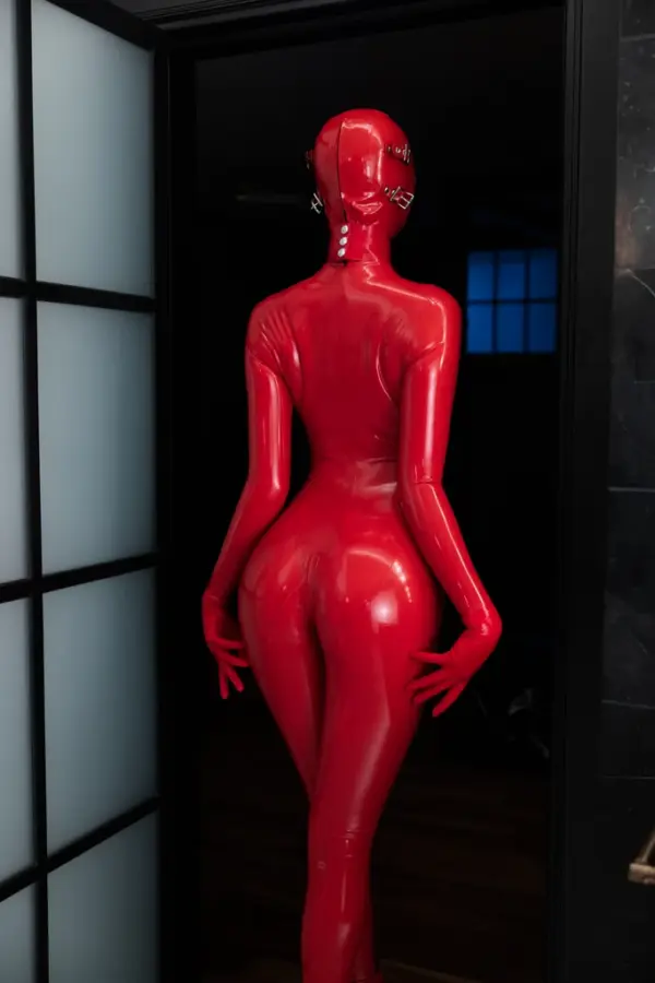 Red latex fetish outfit with detachable hood and corset