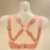 Adjustable heavy duty rubber harness bra back view with gold buckles