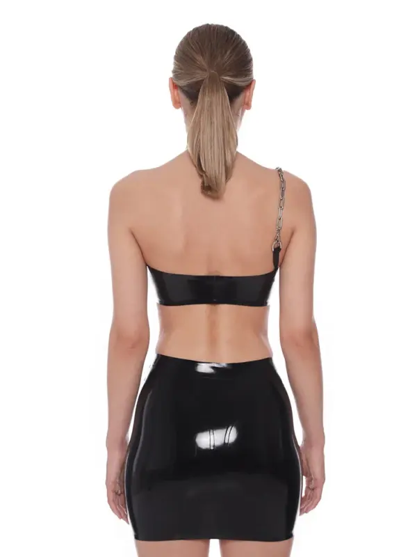 Rear view showing the high neck snap closure and open shoulder design