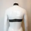 Model dummy wearing extreme cropped rubber fetish halter top showing neck popper fastening and underboob cut
