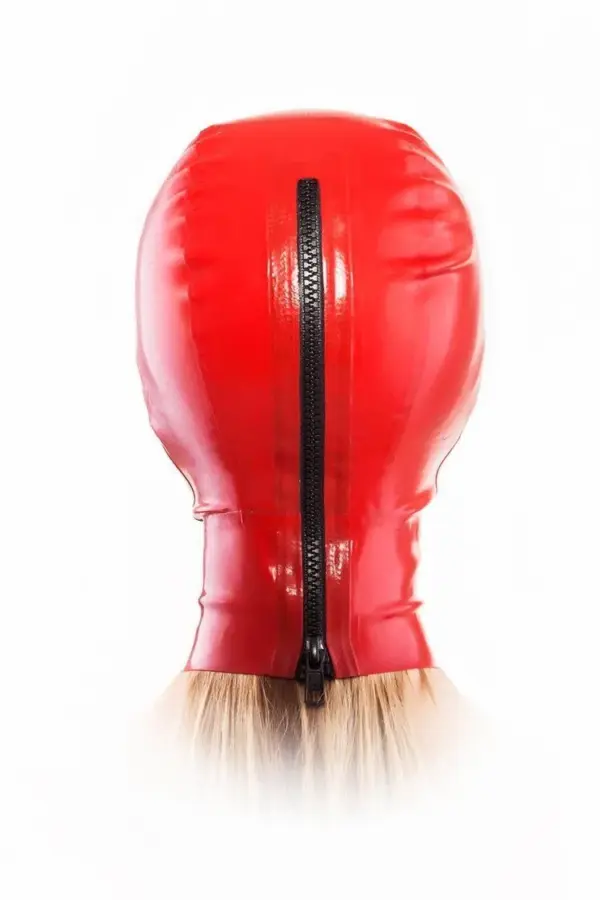 Rear view of red rubber mask with black zipper and hair guard