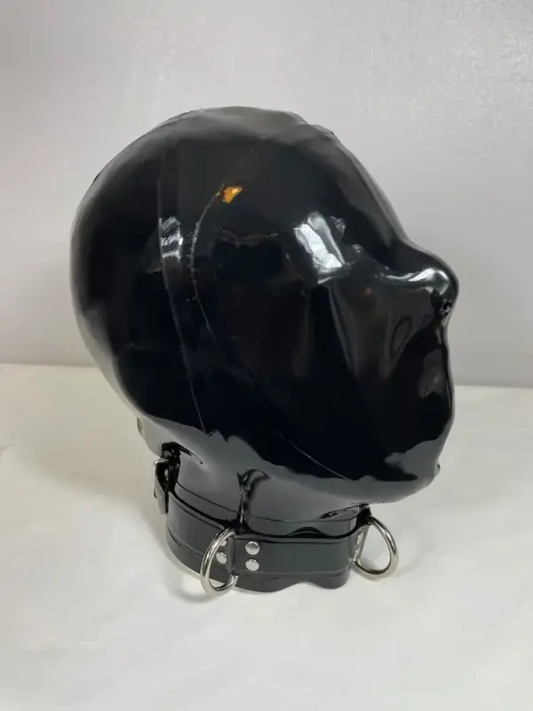 Side view of faceless rubber bondage mask showing metal D-ring detail