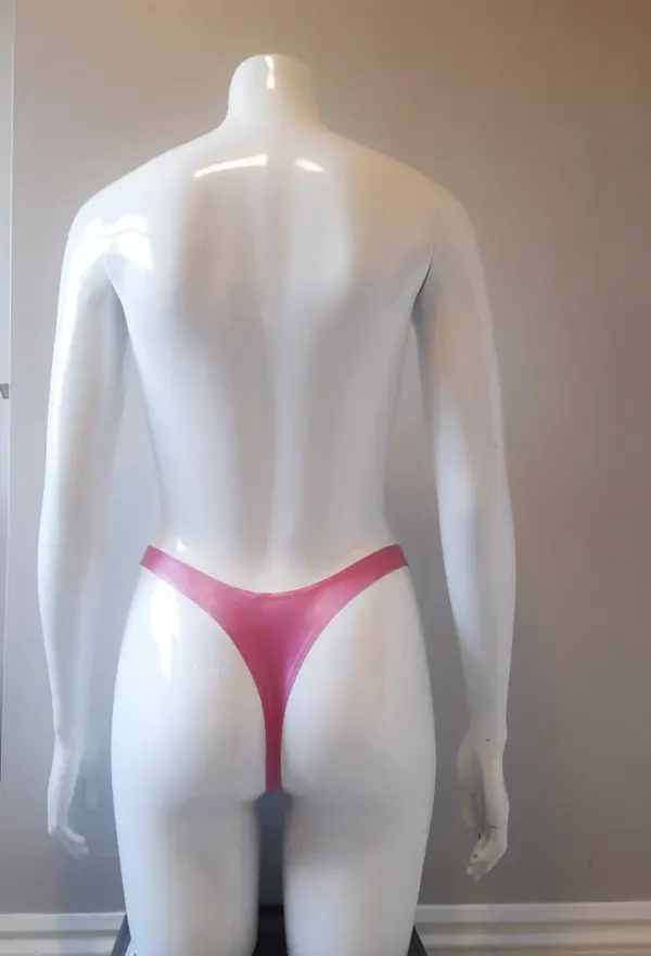 Model wearing sweet and hardcore rubber fetish harness panties showing functional removable o ring