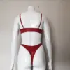 Mannequin wearing pastel and red rubber fetish lingerie set showing adjustable straps and high cut fit