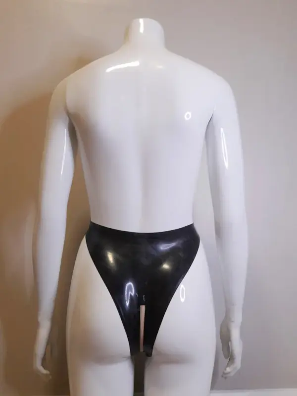 Mannequin wearing leg elongating rubber fetish G-string showing crotch zipper