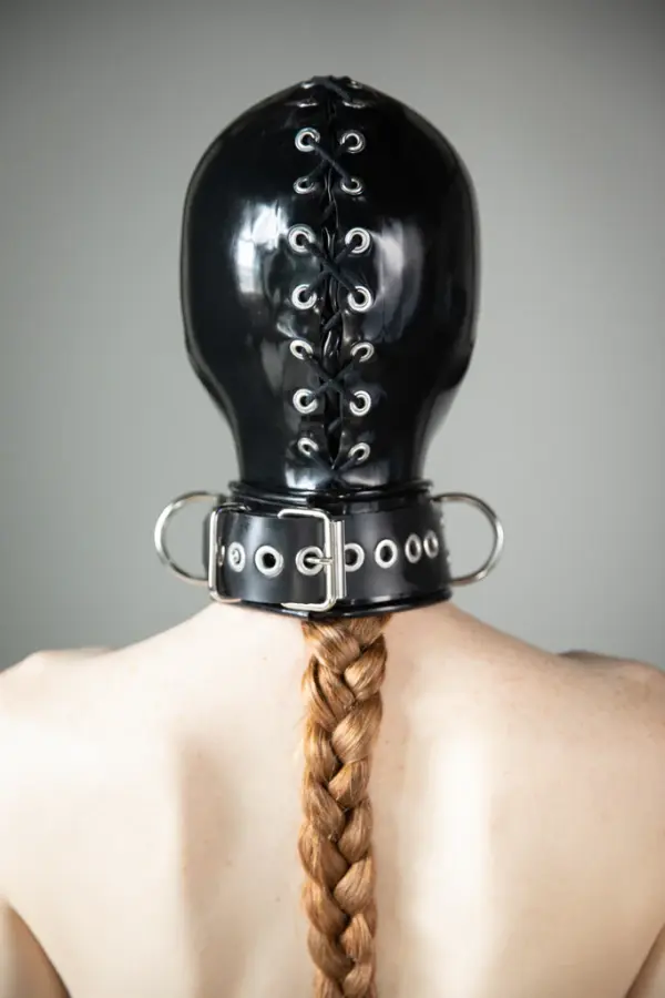 Close up of sensory deprivation latex hood with integrated collar