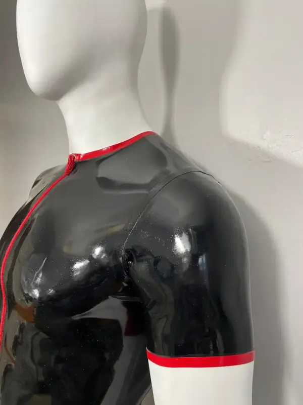 Close up of red zipper and sleeve trim on 0.45mm rubber t-shirt