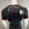 Sleek black latex top for men with red accents sporty style