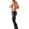 Male model wearing skinny latex trousers with metal hardware details