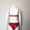 Model wearing classic red rubber fetish two piece set showing supportive round cups and adjustable straps