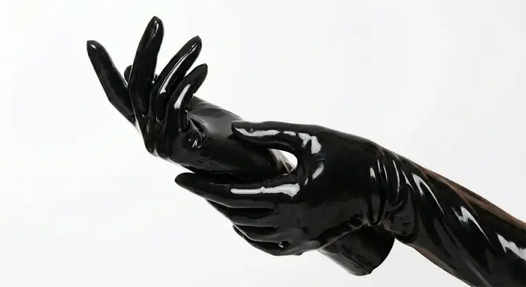 Latex gloves — close-up of black elbow-length latex gloves showing high-gloss mirror finish by LatexLuxe